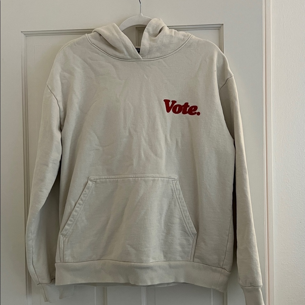 TALENTLESS Cream Hoodie with Red Vote Design